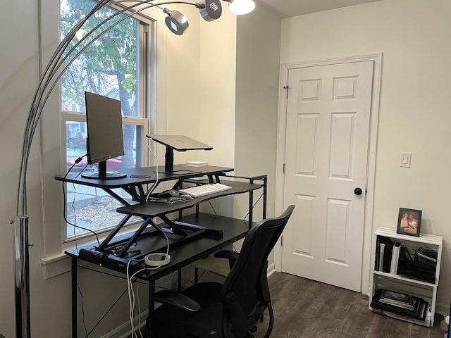 home office with dark hardwood / wood-style flooring