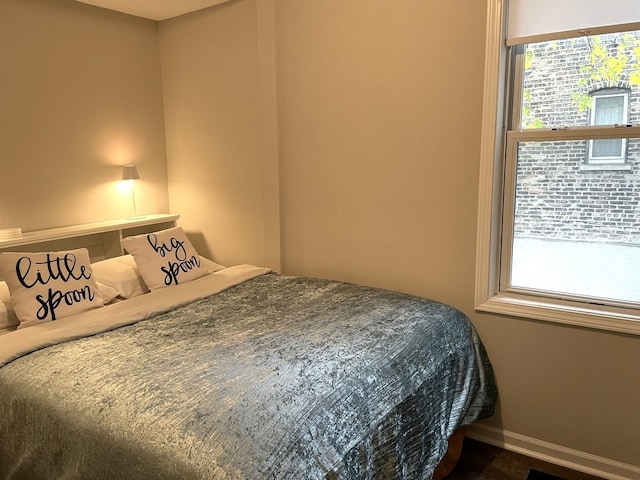 bedroom featuring dark hardwood / wood-style flooring