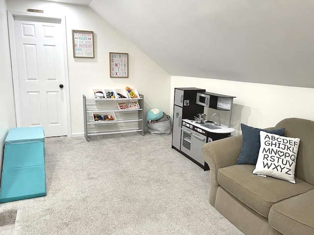 interior space with lofted ceiling and carpet floors