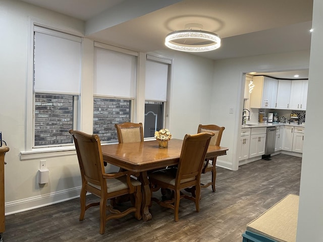 dining area with sink and dark hardwood / wood-style floors