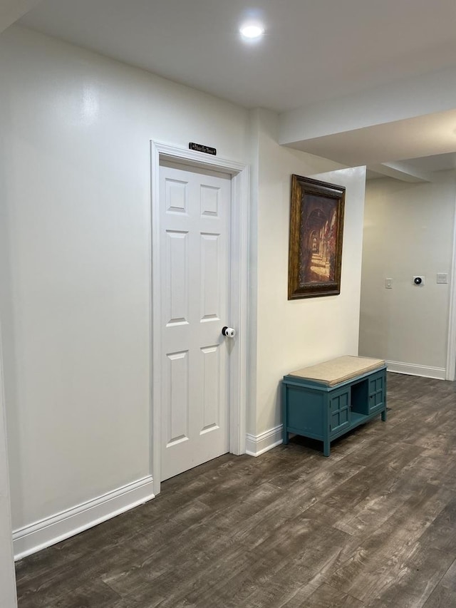 hall with dark hardwood / wood-style flooring