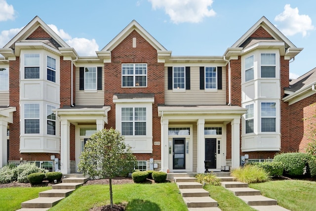 view of property with a front lawn