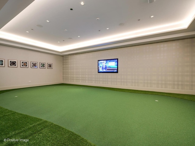 playroom featuring carpet flooring and a tray ceiling