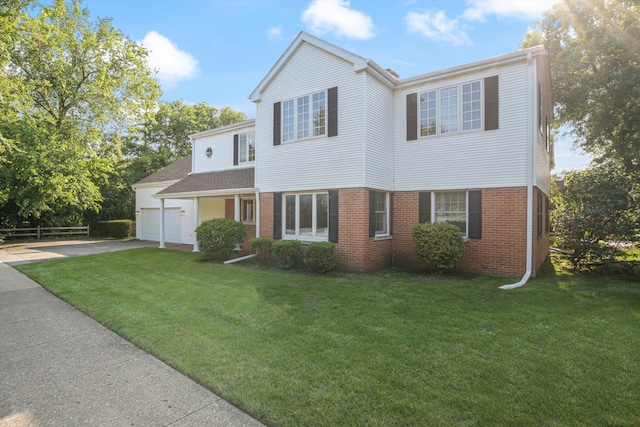 view of front of home featuring a garage and a front yard