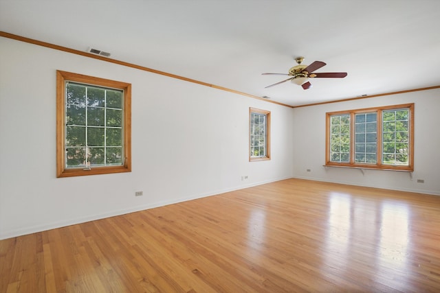 spare room featuring ceiling fan, light hardwood / wood-style floors, and ornamental molding