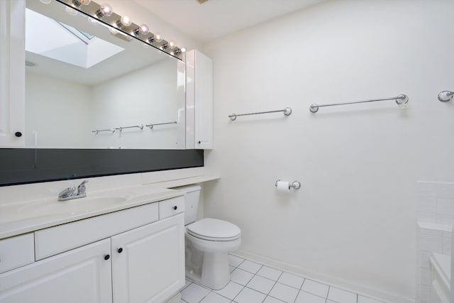 bathroom featuring tile patterned flooring, vanity, and toilet