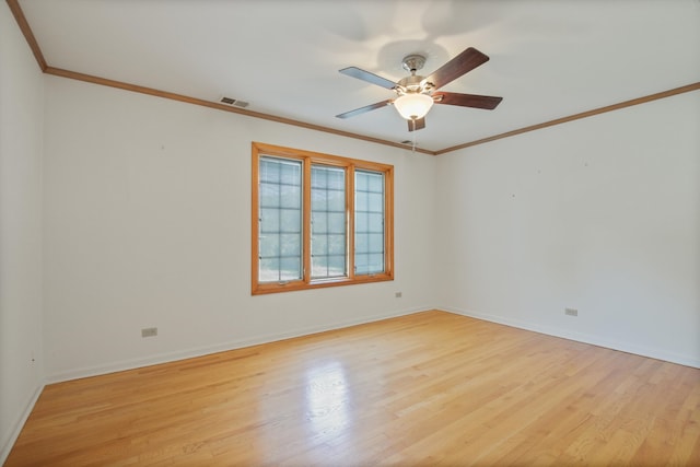 empty room with ceiling fan, light hardwood / wood-style floors, and ornamental molding