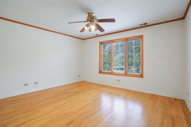 empty room with crown molding, ceiling fan, and light wood-type flooring