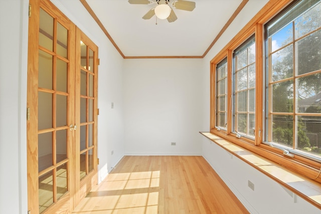 interior space with ceiling fan, light hardwood / wood-style flooring, and ornamental molding