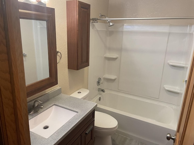 full bathroom featuring vanity, shower / bathtub combination, and toilet