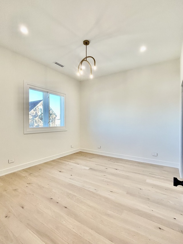 unfurnished room featuring light wood-type flooring