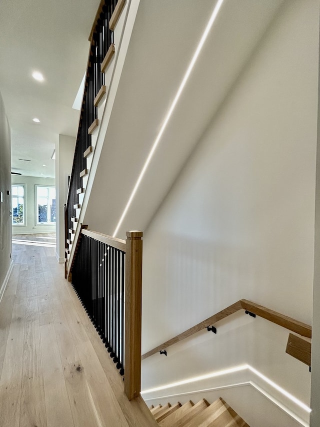 stairway with wood-type flooring