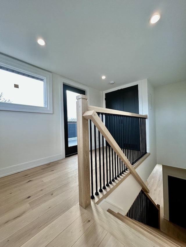 stairway featuring hardwood / wood-style flooring