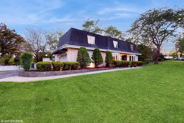 view of property exterior featuring a lawn and a garage