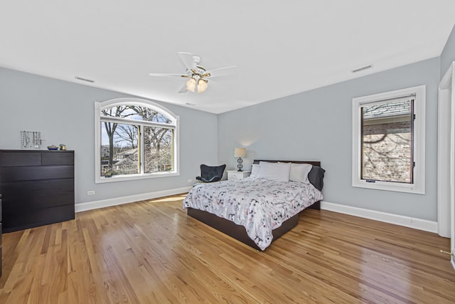 bedroom with hardwood / wood-style floors and ceiling fan