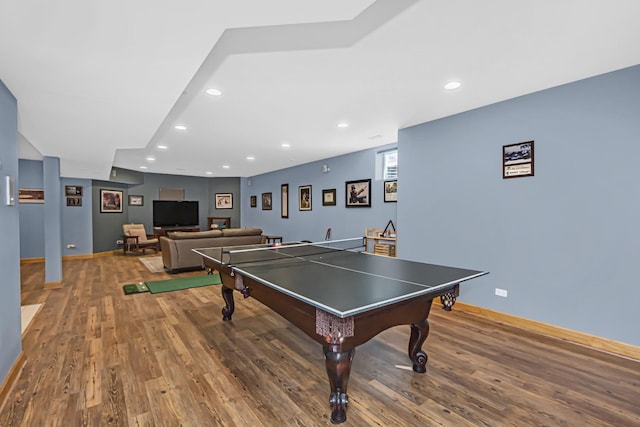 recreation room with wood-type flooring