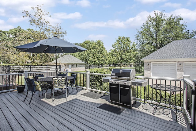 deck featuring a garage and grilling area