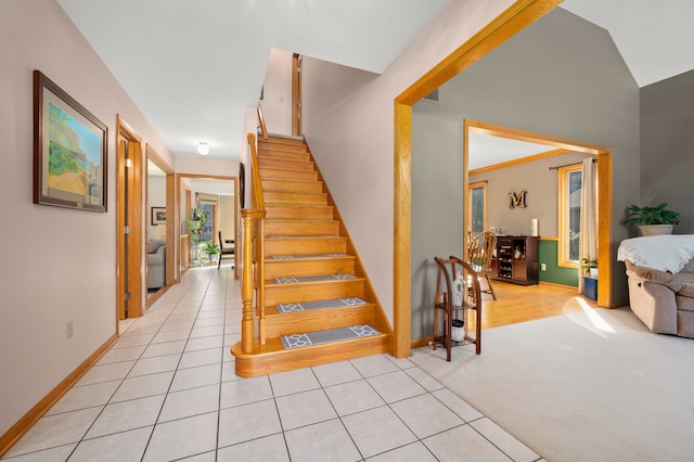 stairs featuring carpet flooring