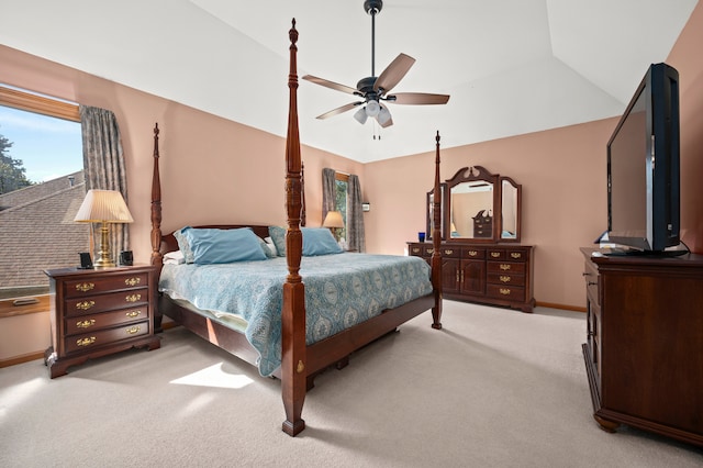 carpeted bedroom featuring ceiling fan and vaulted ceiling