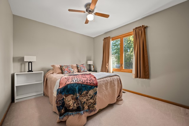 bedroom with light colored carpet and ceiling fan