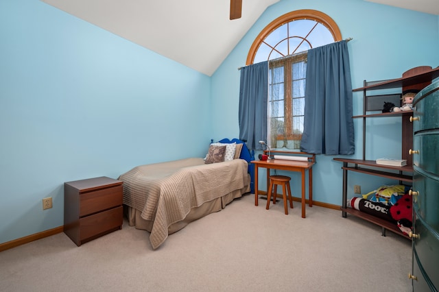 bedroom with carpet flooring, vaulted ceiling, and ceiling fan