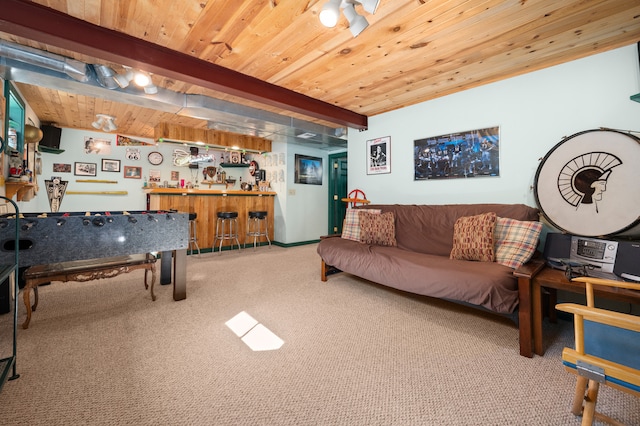 carpeted living room with beamed ceiling, wood ceiling, and indoor bar