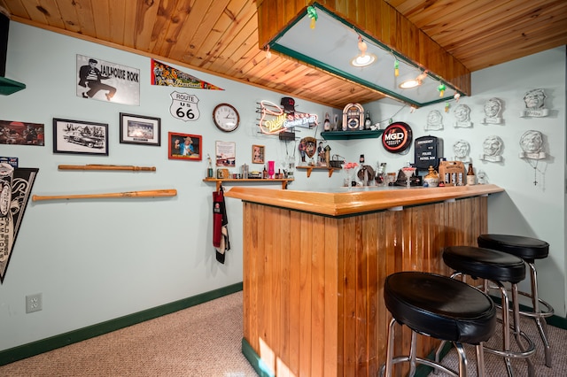 bar with carpet floors and wooden ceiling