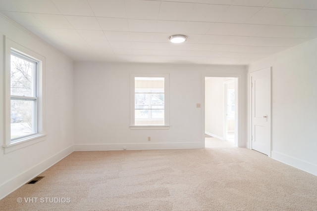 empty room featuring light colored carpet