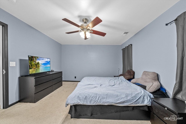 bedroom featuring light carpet and ceiling fan