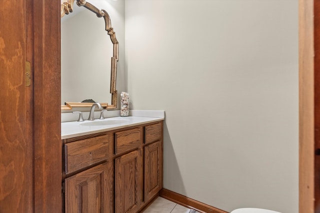 bathroom featuring tile patterned flooring and vanity