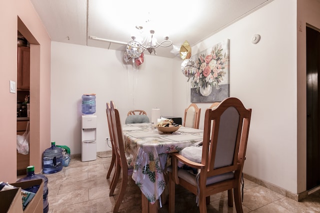 dining room with a notable chandelier