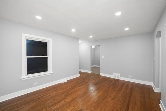 empty room with hardwood / wood-style floors