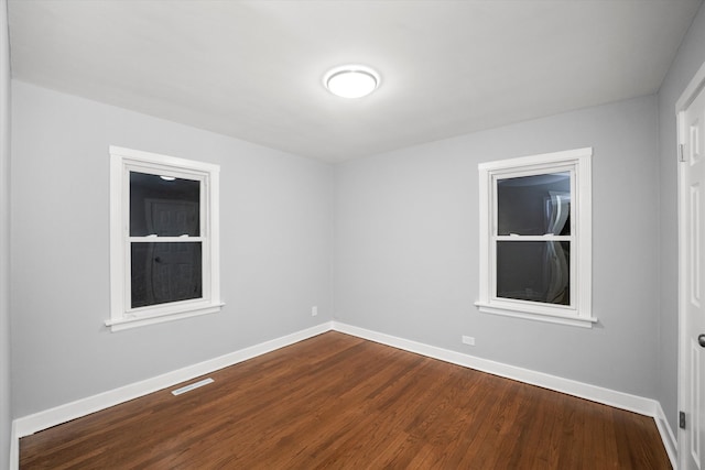 unfurnished room featuring wood-type flooring