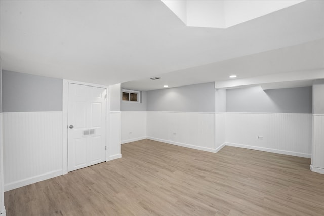 basement with light wood-type flooring