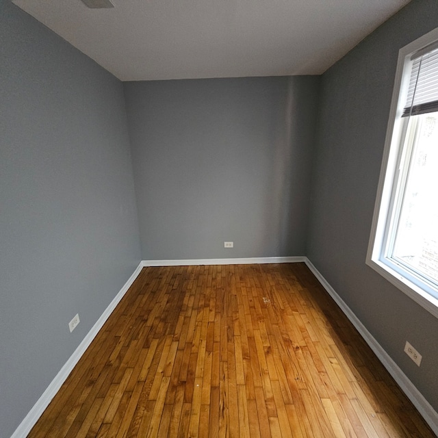 spare room with light hardwood / wood-style floors