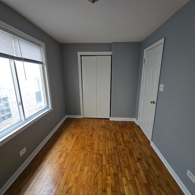 unfurnished bedroom with light hardwood / wood-style floors