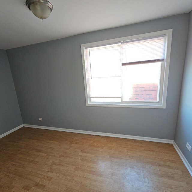 unfurnished room featuring light hardwood / wood-style floors