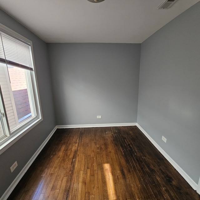 empty room featuring dark hardwood / wood-style floors