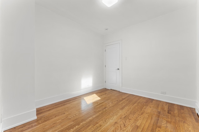 spare room with light hardwood / wood-style flooring