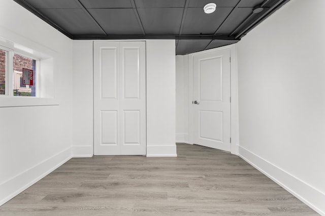 interior space featuring light hardwood / wood-style floors and a closet