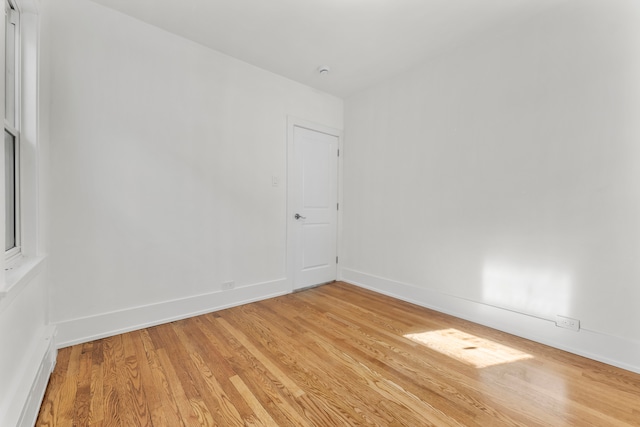 spare room with light hardwood / wood-style floors