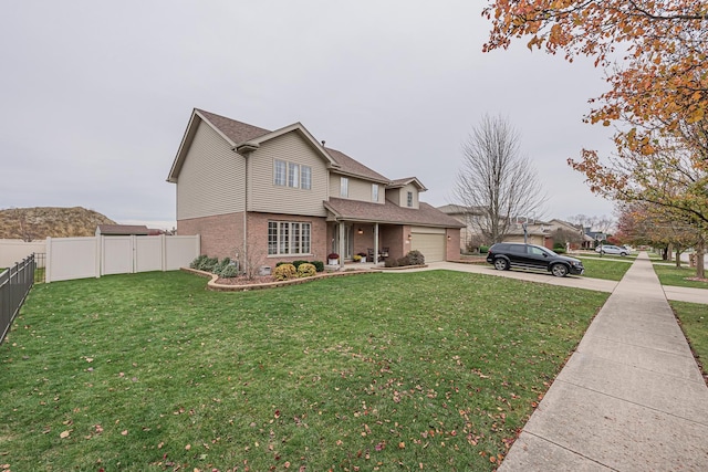 front of property featuring a front lawn and a garage