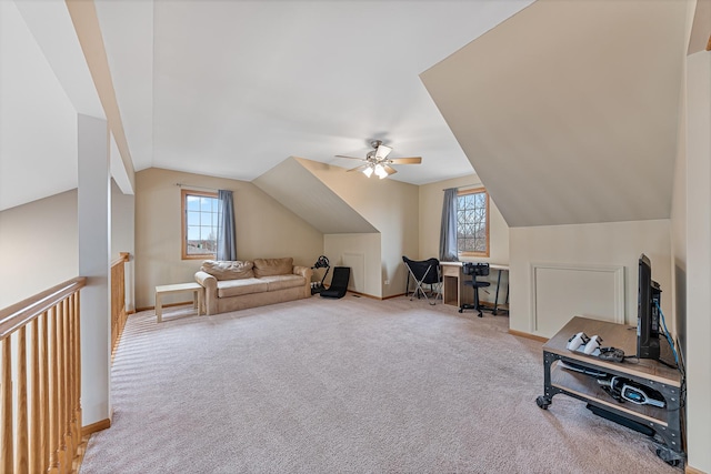 interior space with light carpet, ceiling fan, and lofted ceiling