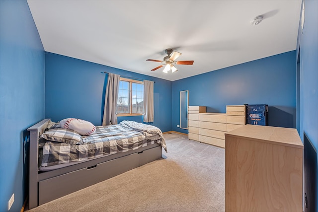 carpeted bedroom featuring ceiling fan