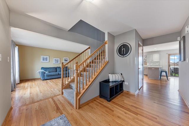 stairs featuring wood-type flooring