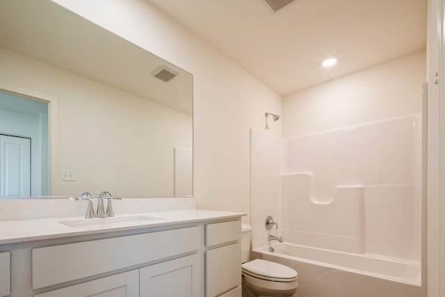 full bathroom with bathtub / shower combination, vanity, and toilet