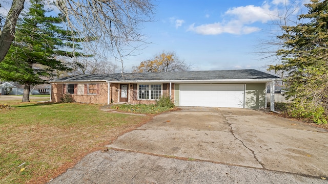 ranch-style house featuring a front lawn and a garage