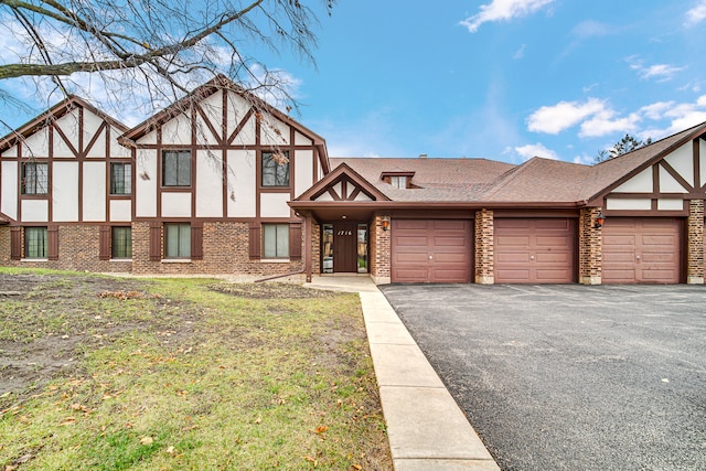 tudor home featuring a garage