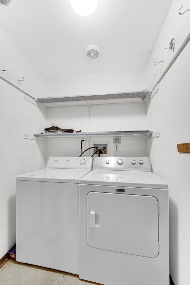 laundry room featuring washing machine and clothes dryer