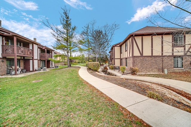 view of community featuring a yard